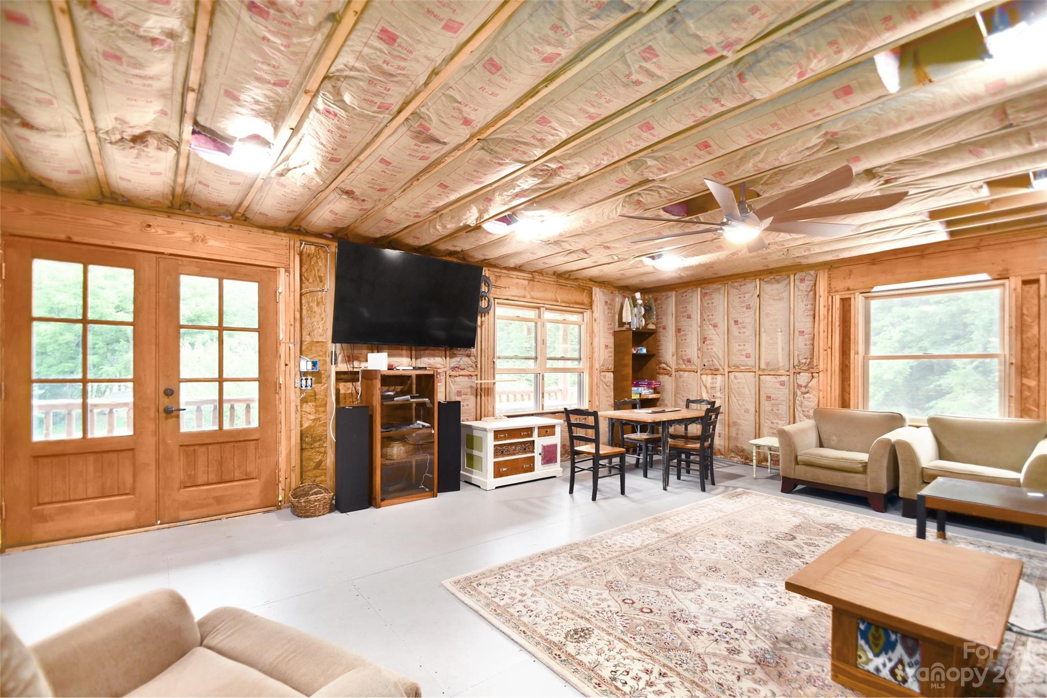 19201 Davidson-Concord Road Davidson, NC 28036 - Photo 31 of 47 a living room with furniture and a flat screen tv