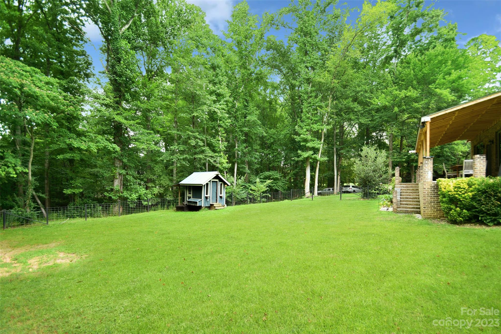 19201 Davidson-Concord Road Davidson, NC 28036 - Photo 41 of 47 a view of a house with a yard and sitting area