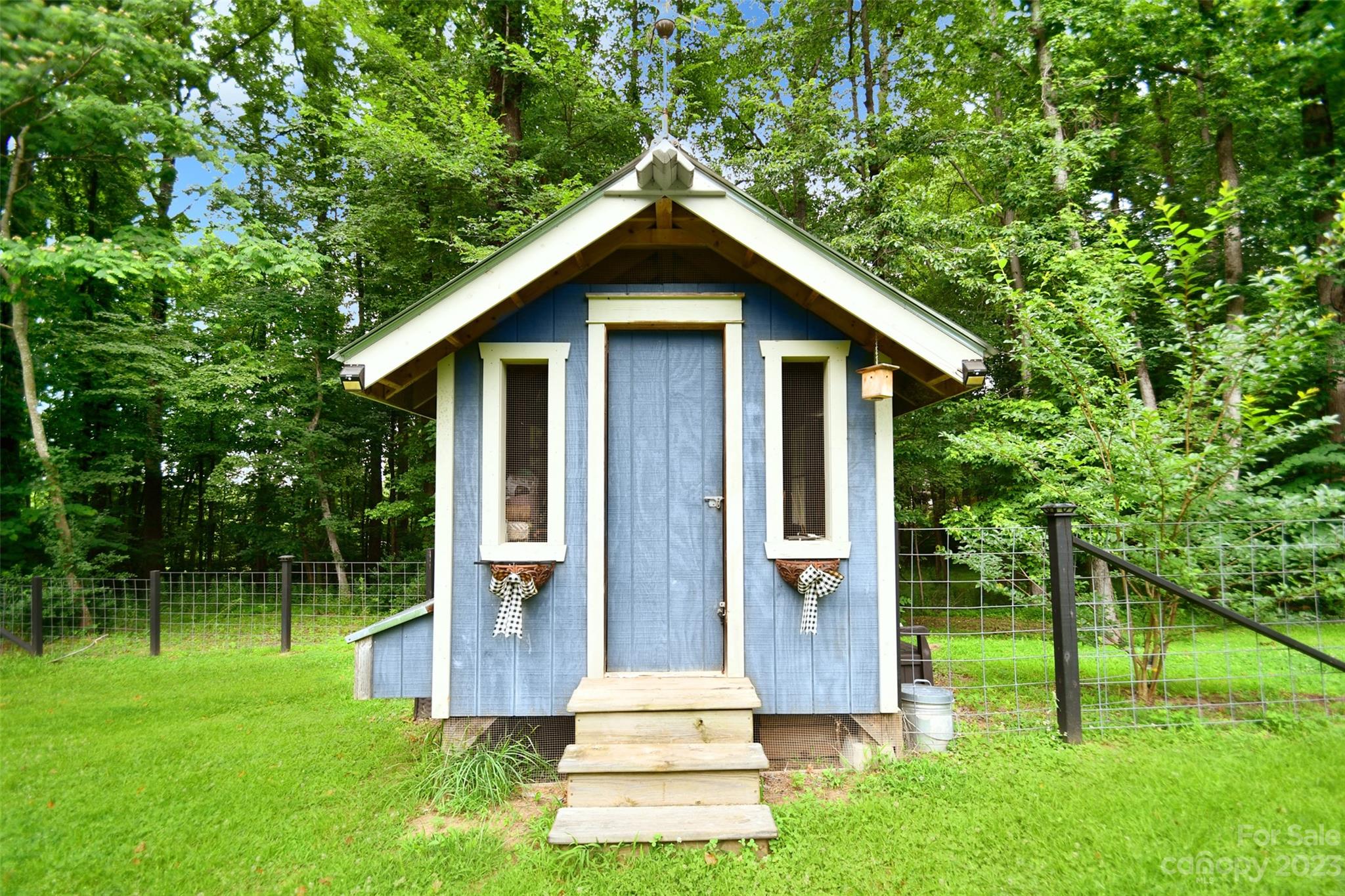 19201 Davidson-Concord Road Davidson, NC 28036 - Photo 42 of 47 a front view of house with a yard and potted plants