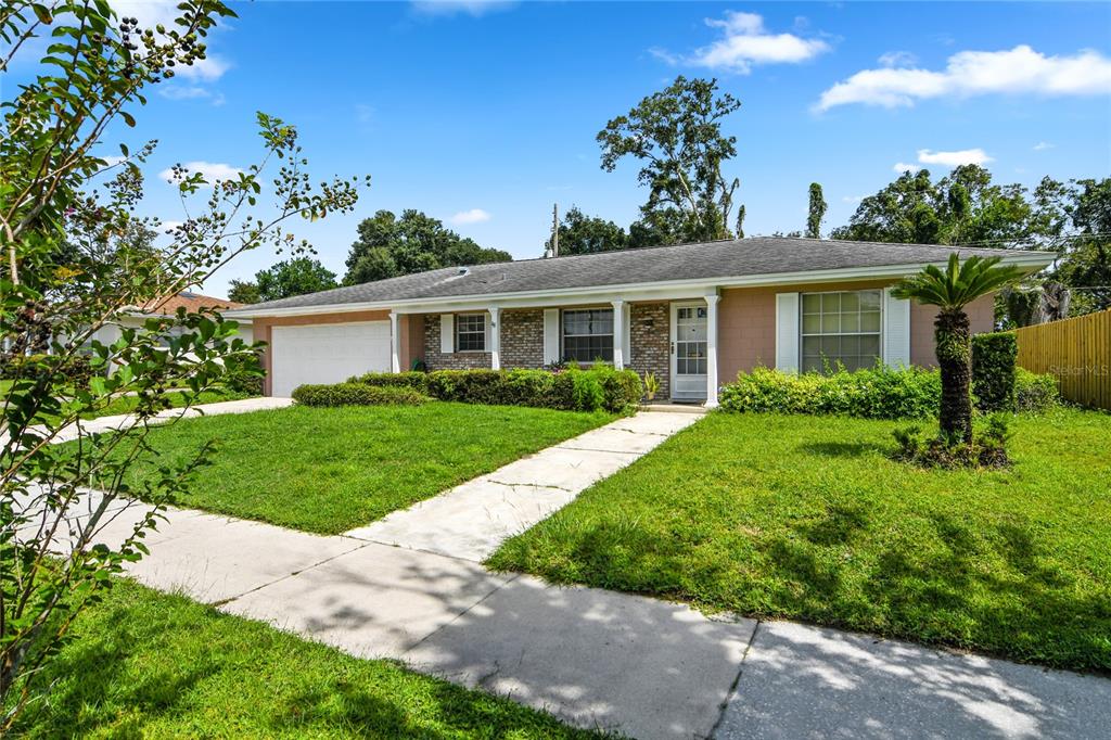 1733 Gaston Foster Road Orlando, FL 32812 - Photo 1 of 1 a front view of a house with a garden