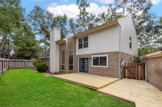 a view of a house with a yard and garage