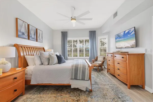 a bedroom with furniture and windows