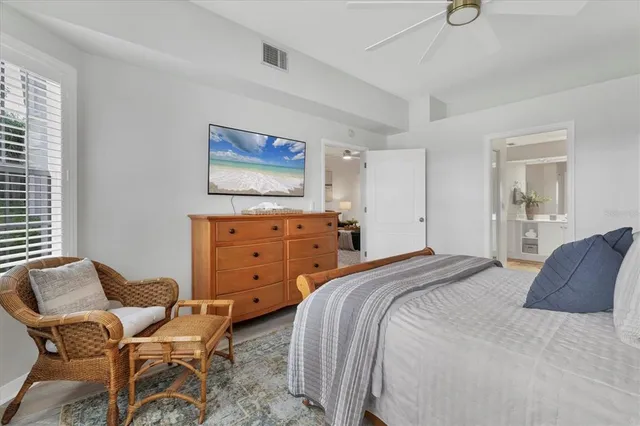 a bedroom with a bed and chair