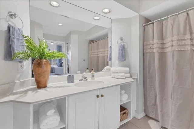 a bathroom with a sink a vanity and a mirror
