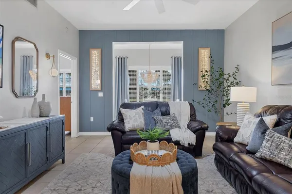 a living room with furniture and a large window