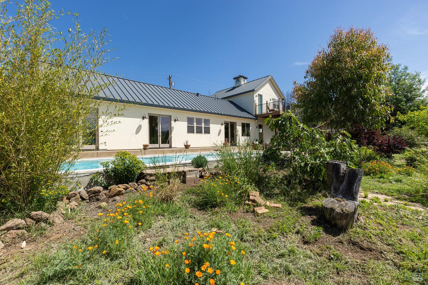 753 Sunnyside Road St. Helena, CA 94574 - Photo 51 of 55 a front view of a house with a yard and potted plants