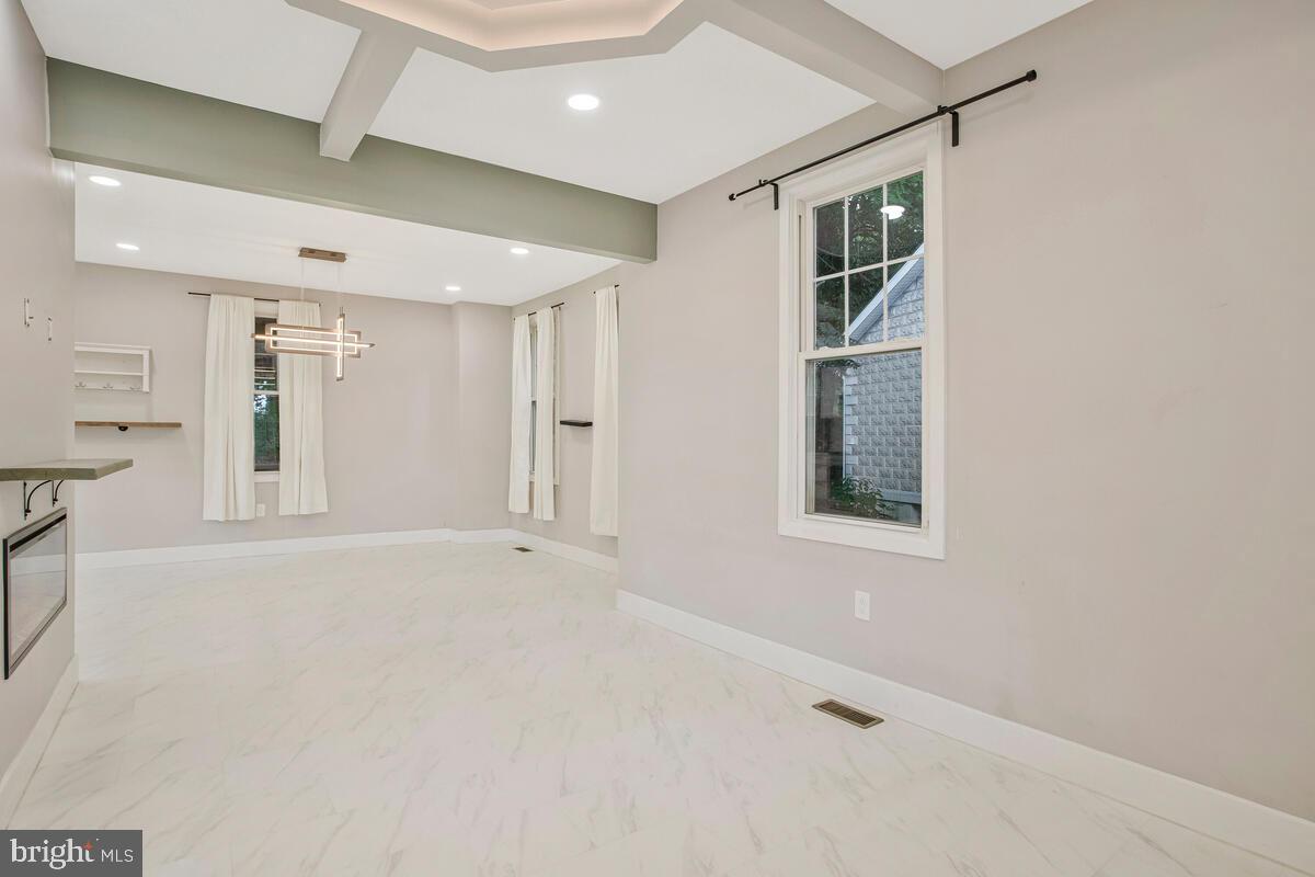 6204 Everall Avenue Baltimore, MD 21206 - Photo 15 of 34 an empty room with windows