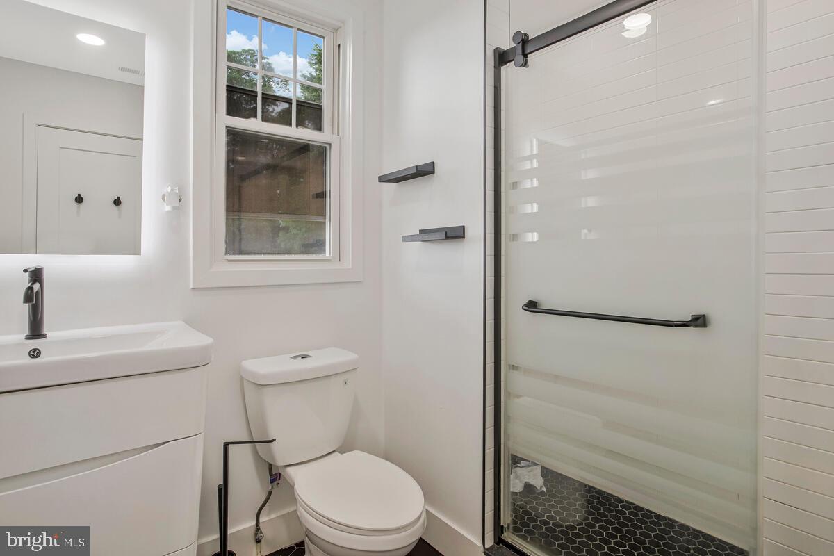 6204 Everall Avenue Baltimore, MD 21206 - Photo 18 of 34 a bathroom with a toilet a sink and shower