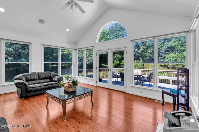 a bedroom with a bed next to a window with outer view