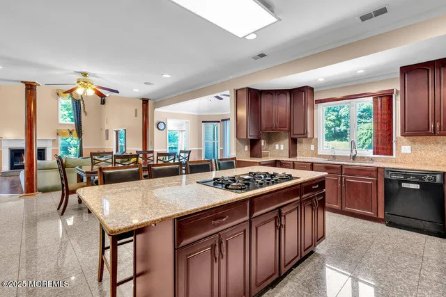 a view of a livingroom with furniture and stairs