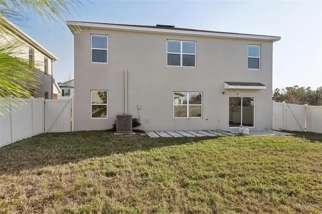 a view of a backyard of the house