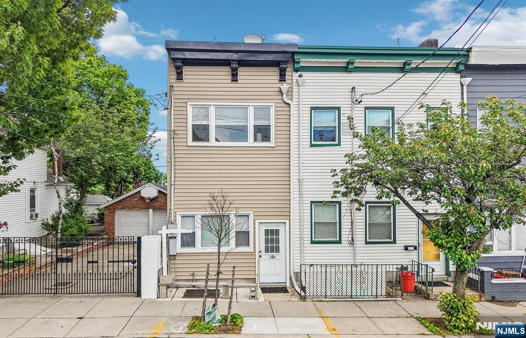 90 A Hackensack Plank Road Weehawken, NJ 07086 - Photo 1 of 40 a front view of a house with a garage