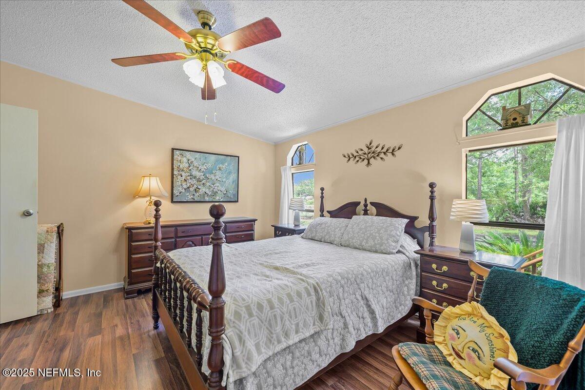 54451 Marsh Road Callahan, FL 32011 - Photo 12 of 26 a bedroom with a bed and a window