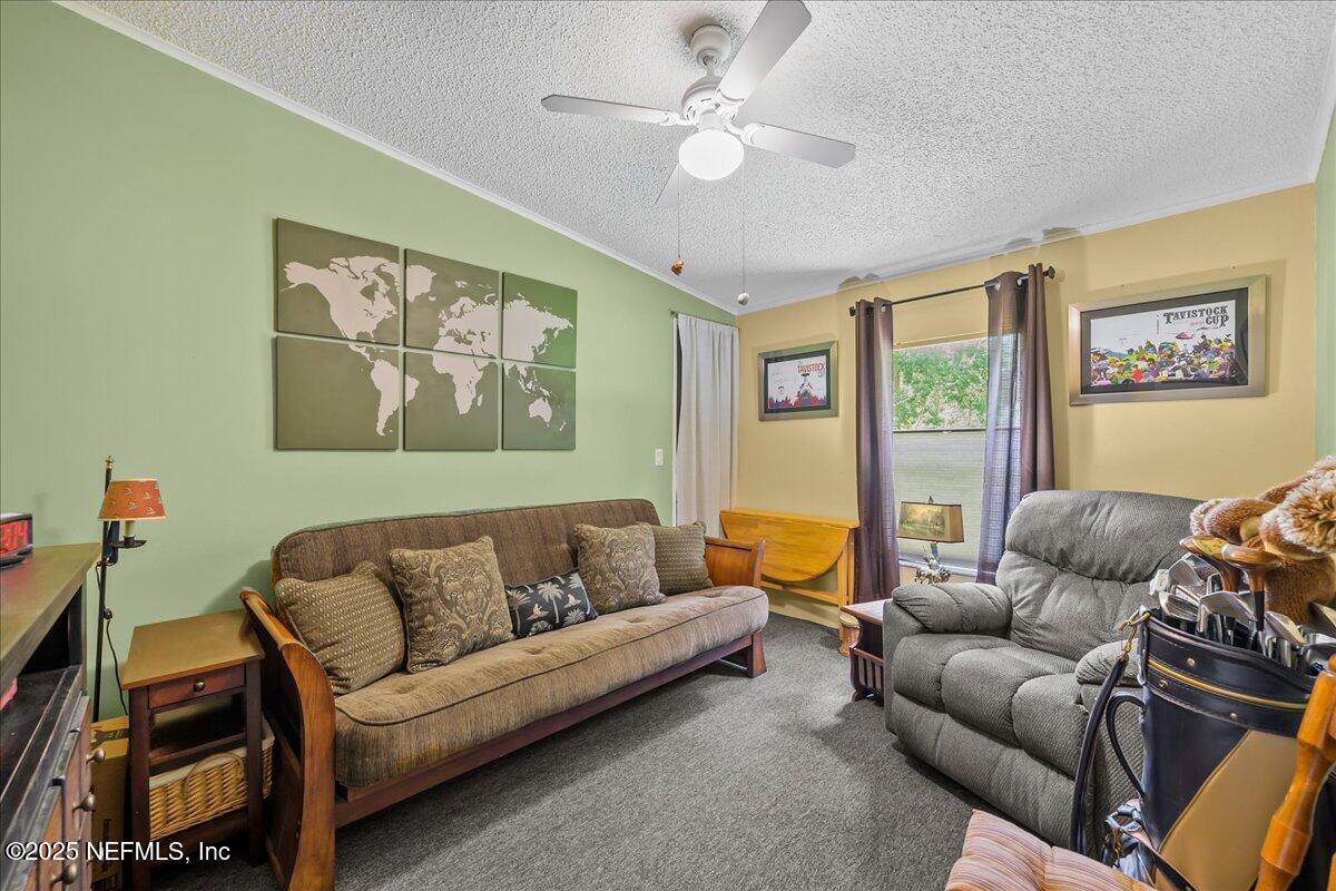 54451 Marsh Road Callahan, FL 32011 - Photo 16 of 26 a living room with furniture a couch and a window