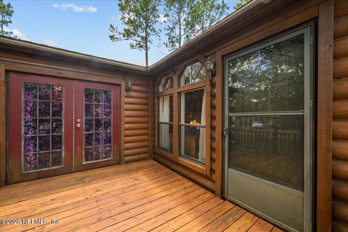 54451 Marsh Road Callahan, FL 32011 - Photo 3 of 26 a view of front door deck and living room