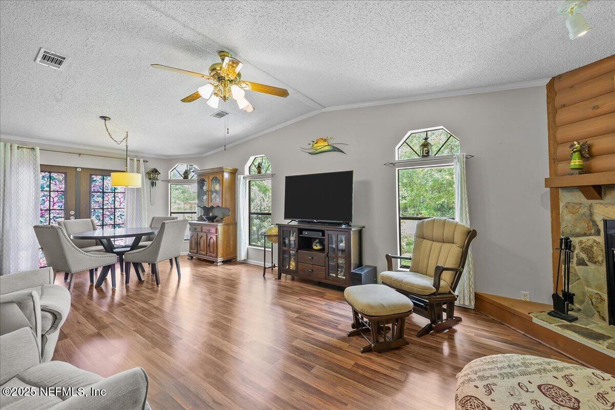 54451 Marsh Road Callahan, FL 32011 - Photo 9 of 26 a living room with furniture a window and a flat screen tv