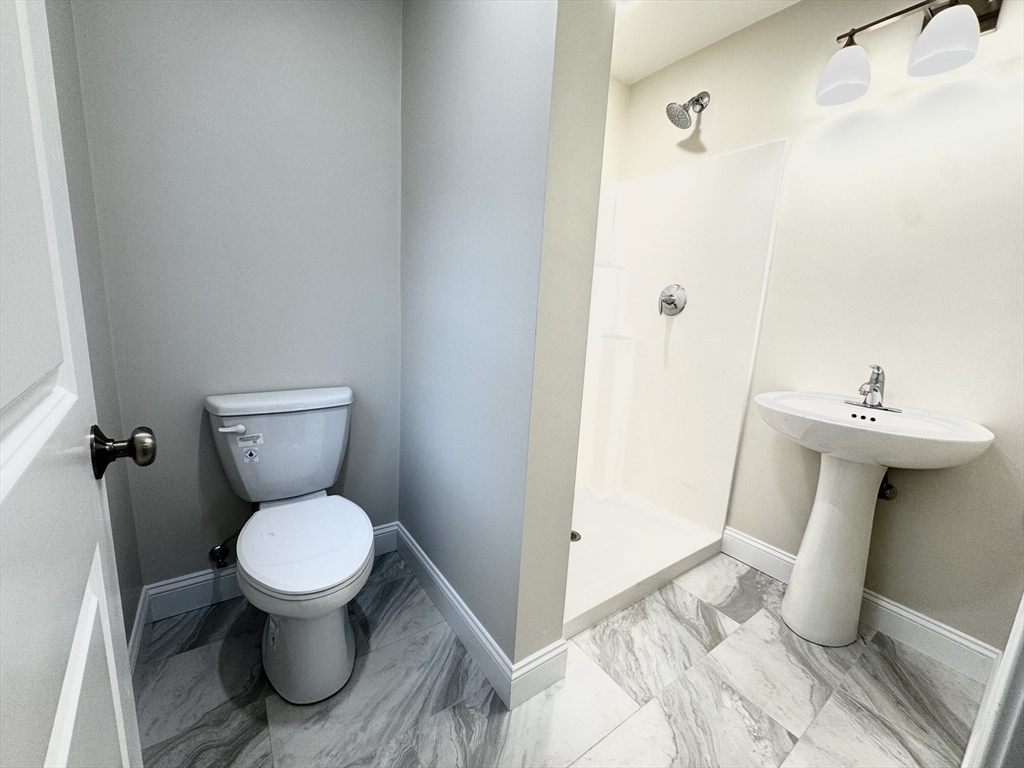 78 Arlington Street, Unit 2 Taunton, MA 02780 - Photo 16 of 28 a bathroom with a sink and toilet