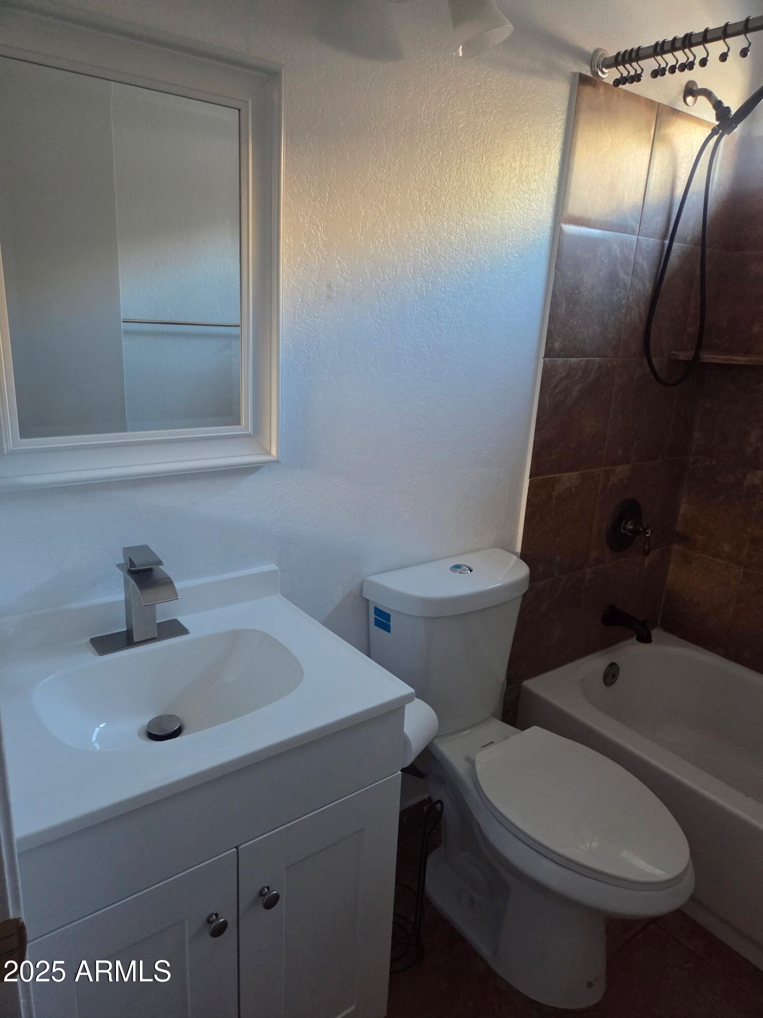 3009 East Utopia Road Phoenix, AZ 85050 - Photo 7 of 13 a bathroom with a sink and a mirror