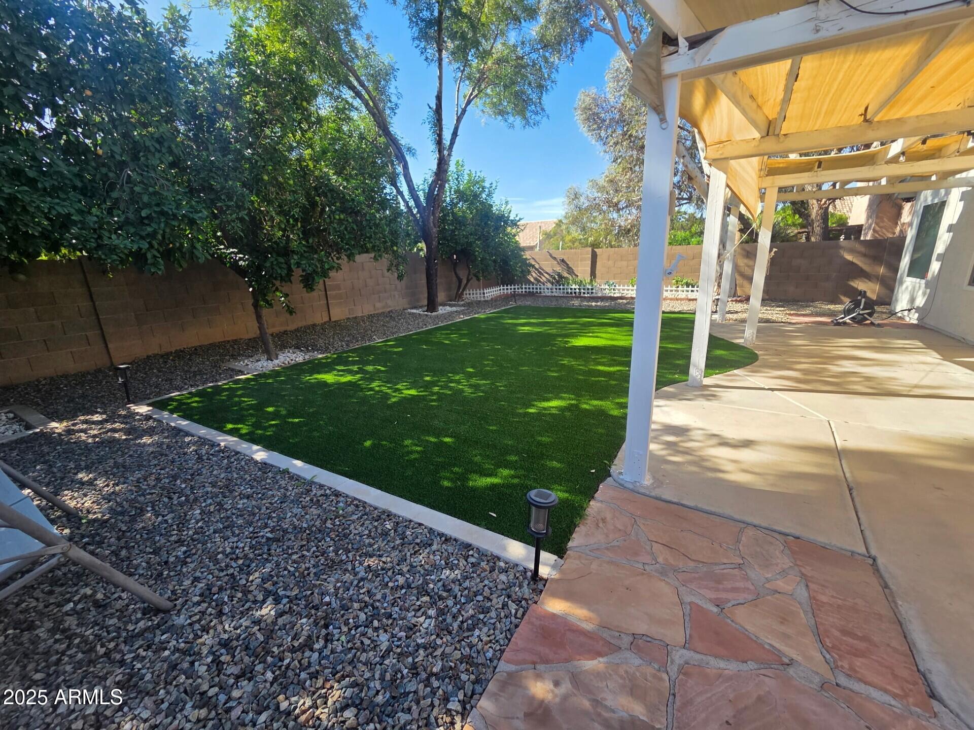 3009 East Utopia Road Phoenix, AZ 85050 - Photo 9 of 13 a view of a porch with a backyard
