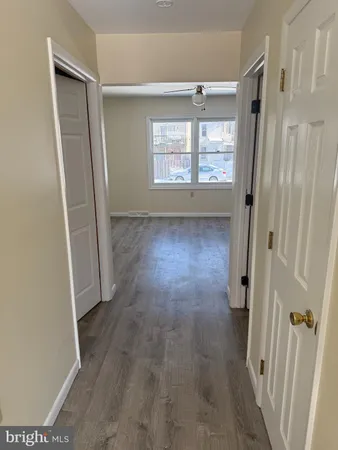 wooden floor in an empty room and a window