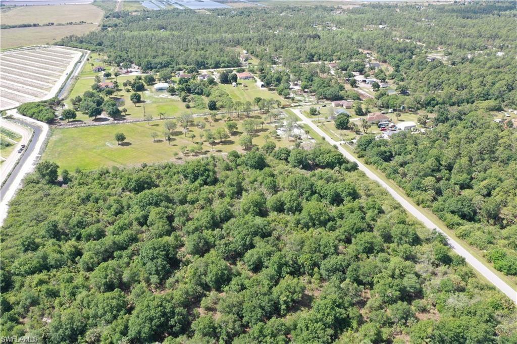 46th Street Northeast Naples, FL 34120 - Photo 4 of 4 an aerial view of residential houses with outdoor space and trees