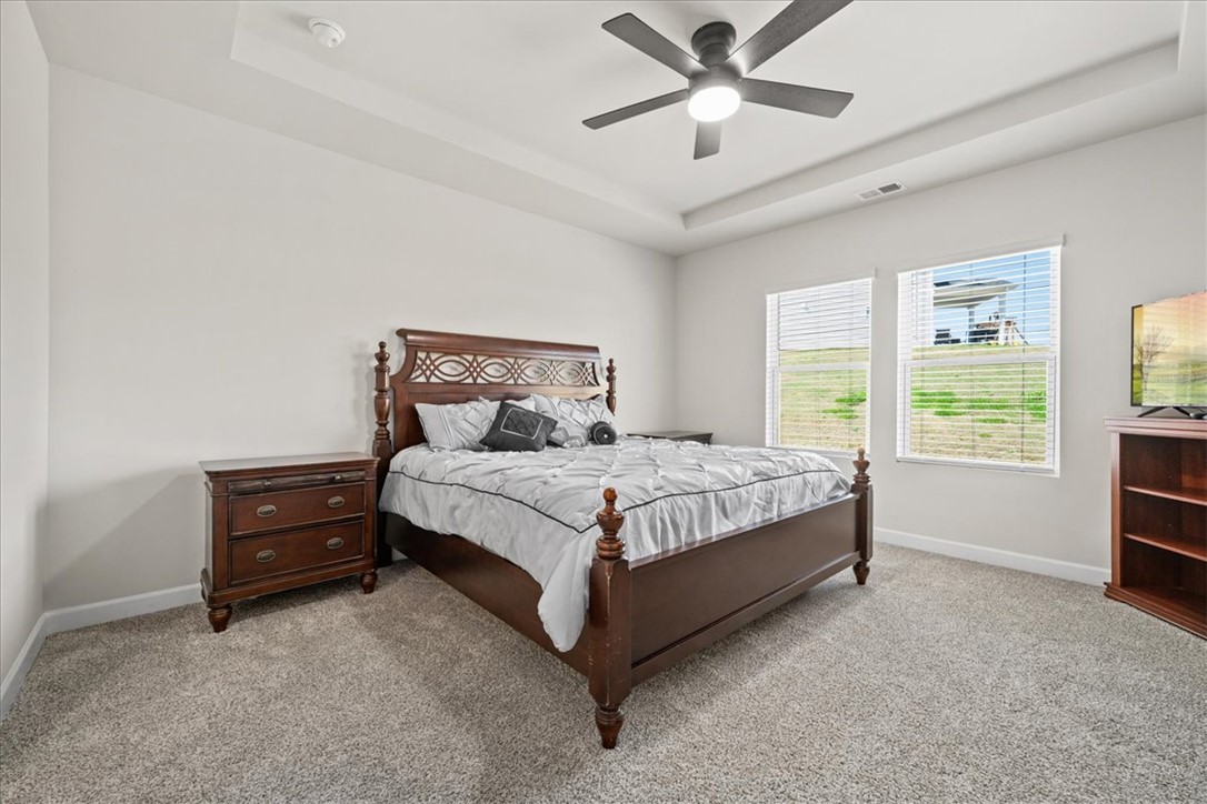 106 Purcell Way Easley, SC 29642 - Photo 16 of 39 This restful bedroom features a tray ceiling and a soothing ambiance.