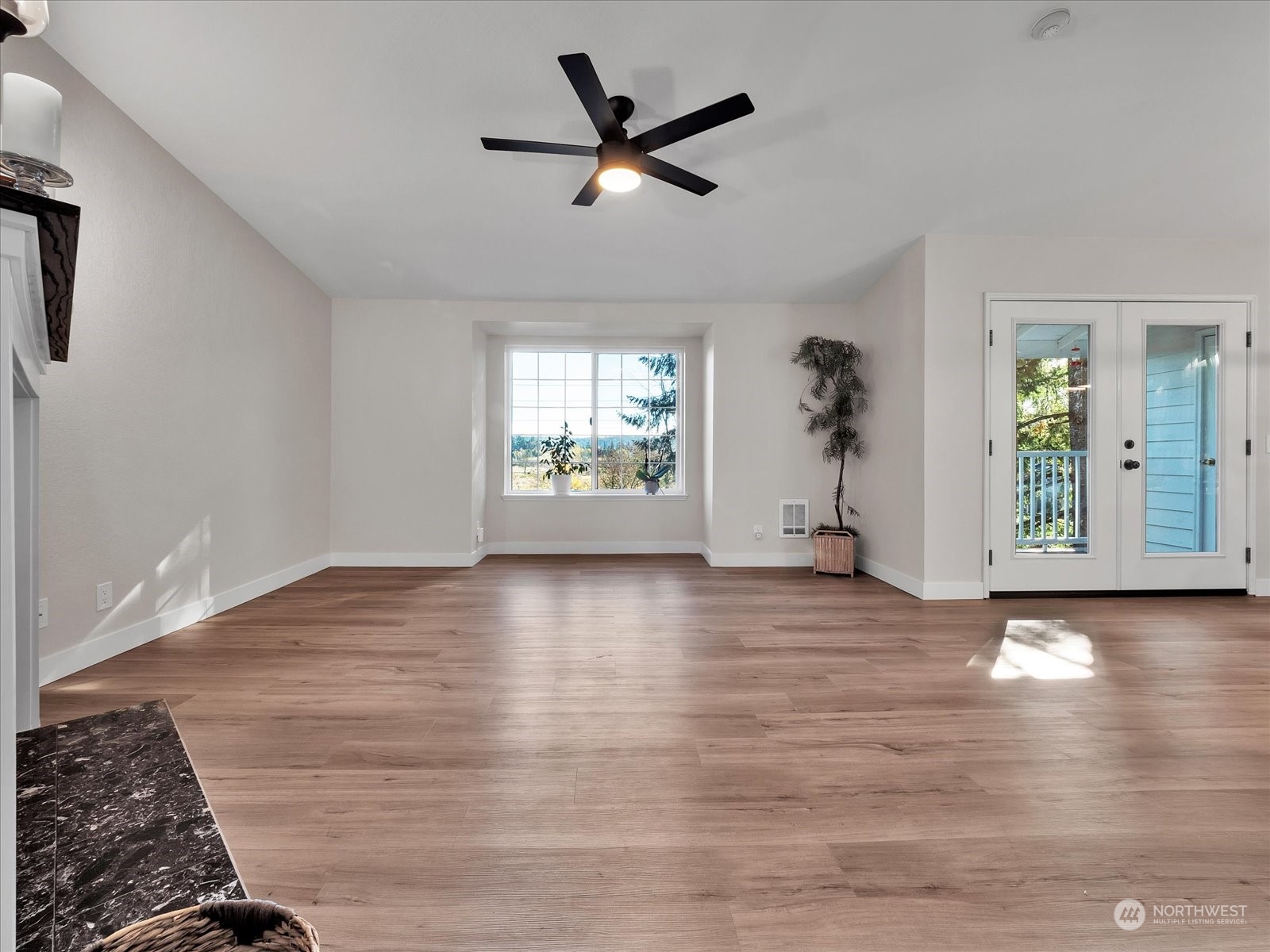 8653 Avondale Road Northeast, Unit A301 Redmond, WA 98052 - Photo 8 of 28 wooden floor in an empty room with a window