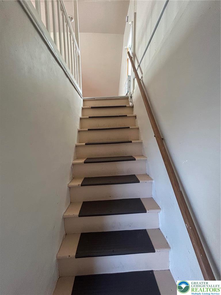 1122 East 4th Street Bethlehem, PA 18015 - Photo 11 of 13 Clean lines define this interior staircase, connecting levels with simple elegance.