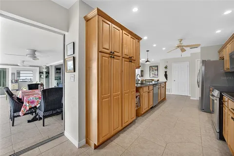 a kitchen with stainless steel appliances a refrigerator and a stove