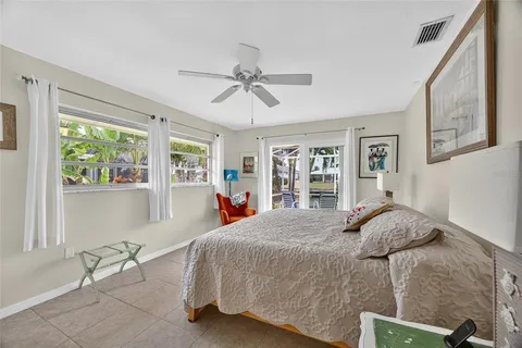 a bedroom with a bed dresser and a window