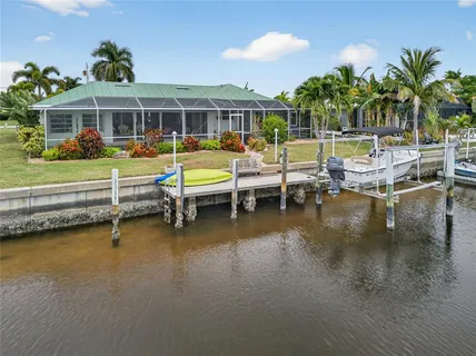 a view of a swimming pool and lounge chair