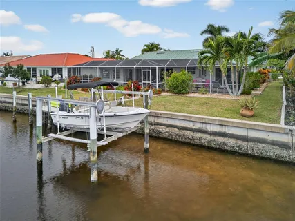 a view of a swimming pool with a lounge chair