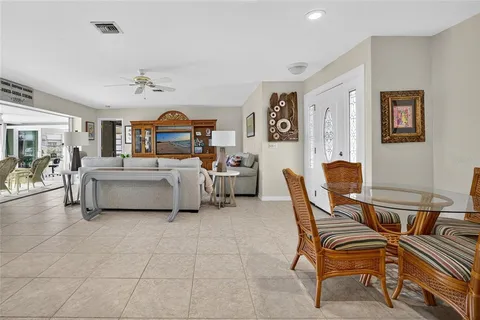 a living room with furniture and a mirror