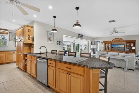 a kitchen with stainless steel appliances granite countertop a sink and stove
