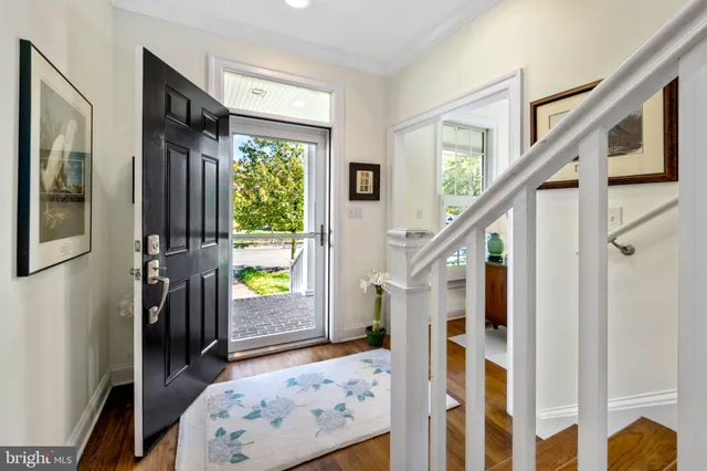 a kitchen with cabinets and chairs