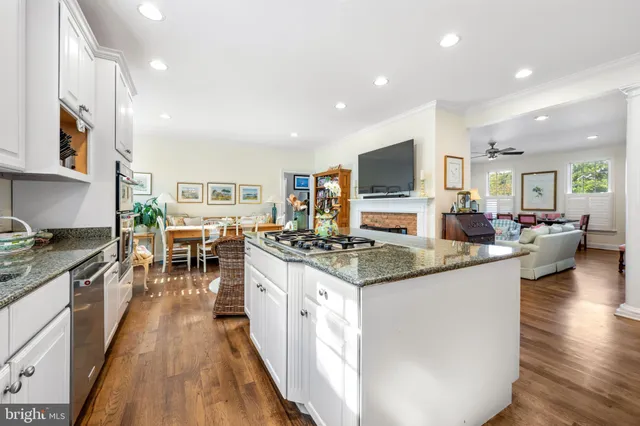 a spacious bedroom with a bed couch and window