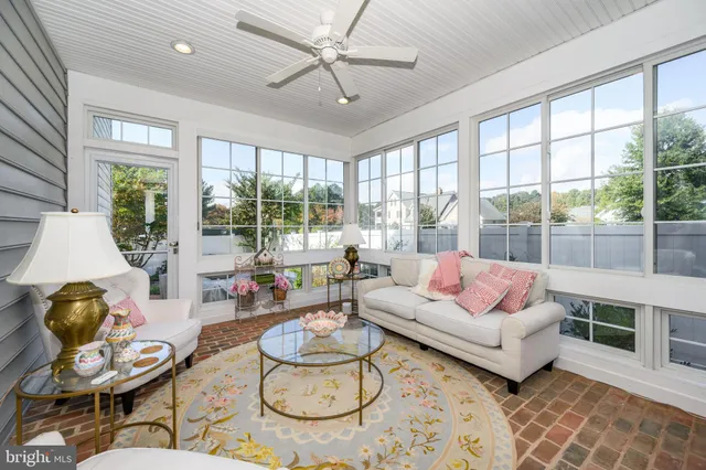 a bathroom with a granite countertop sink mirror and window
