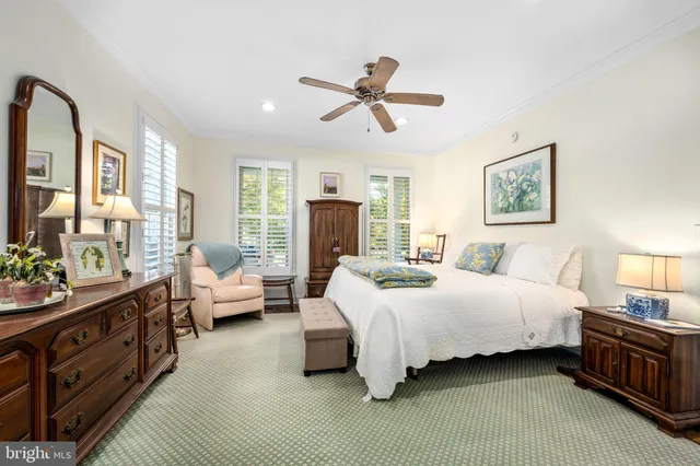 a dining room with furniture a rug and wooden floor