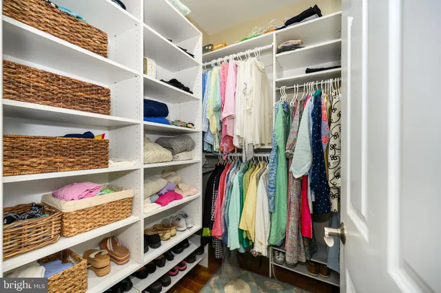 a living room with furniture a window and a flat screen tv