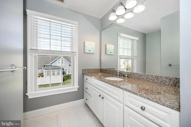 a view of a lake with boats and trees all around