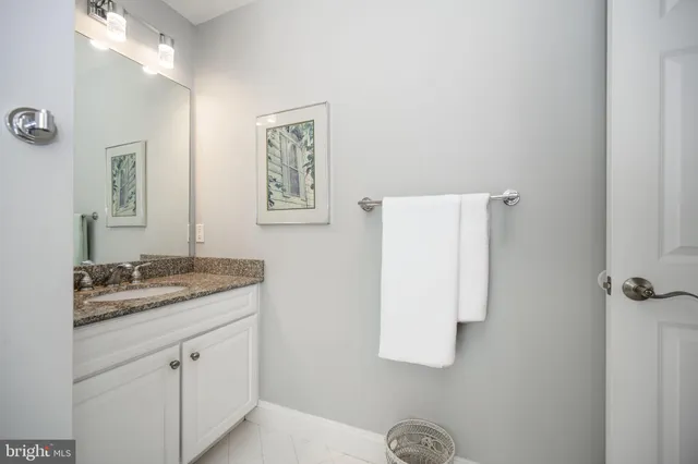 a view of a street with a house in the background