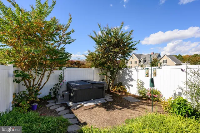 a backyard of a house with outdoor seating