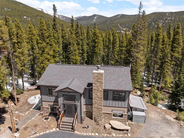 a view of a terrace with a table and chairs