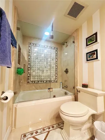 a bathroom with a toilet a sink and bathtub