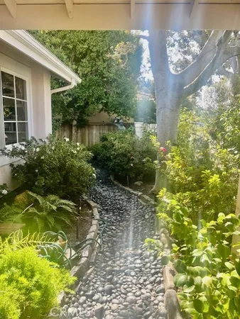 a view of house with yard