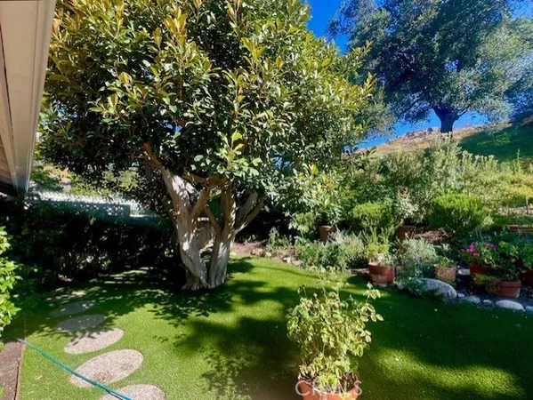 a backyard of a house with a garden