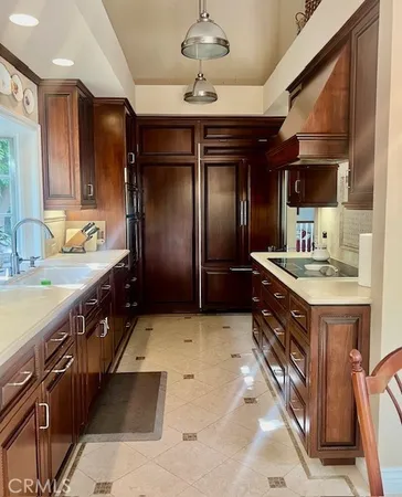 a bathroom with a sink double vanity and a large mirror