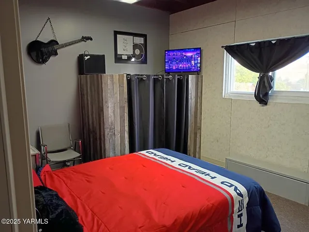 a bed room with a bed and a book shelf