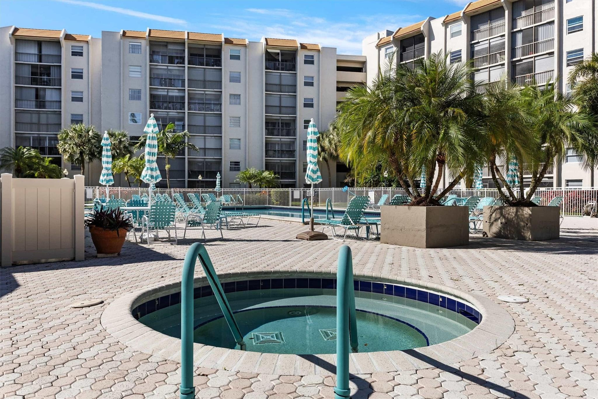 3910 Inverrary Boulevard, Unit 708B Lauderhill, FL 33319 - Photo 54 of 58 a view of a swimming pool with a lounge chairs