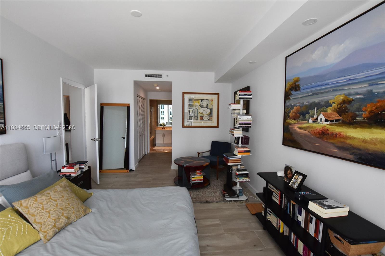 801 Brickell Key Boulevard, Unit 1209 Miami, FL 33131 - Photo 14 of 52 a living room with furniture and a flat screen tv